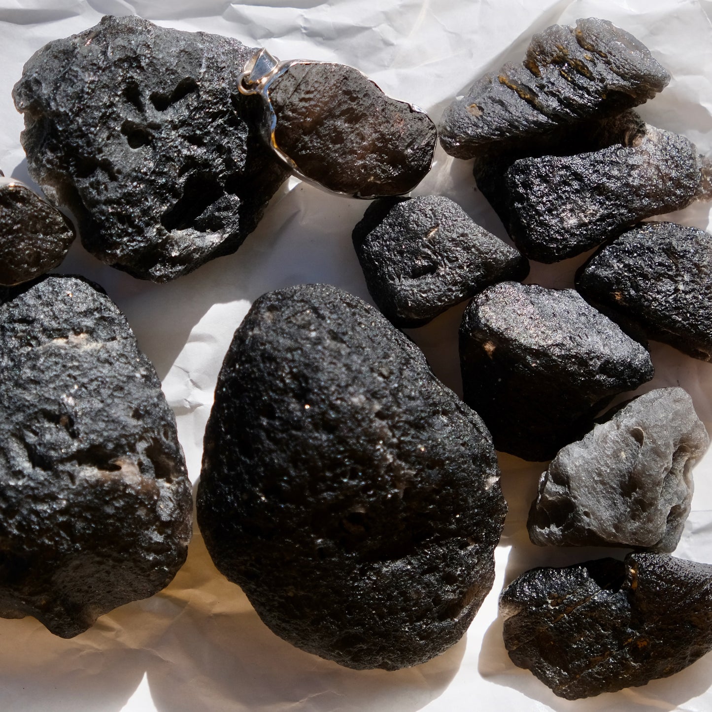 Agni Manitite raw stones, black, semi translucent .