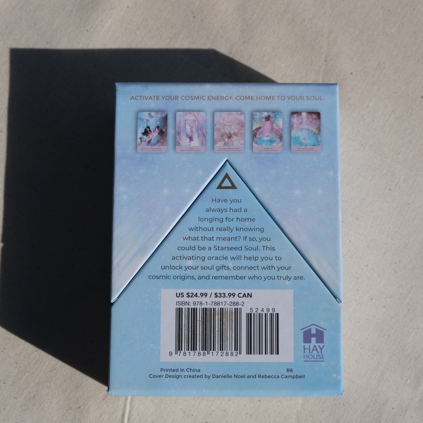 Back of Oracle card box with pictures of cards and description of oracle deck.