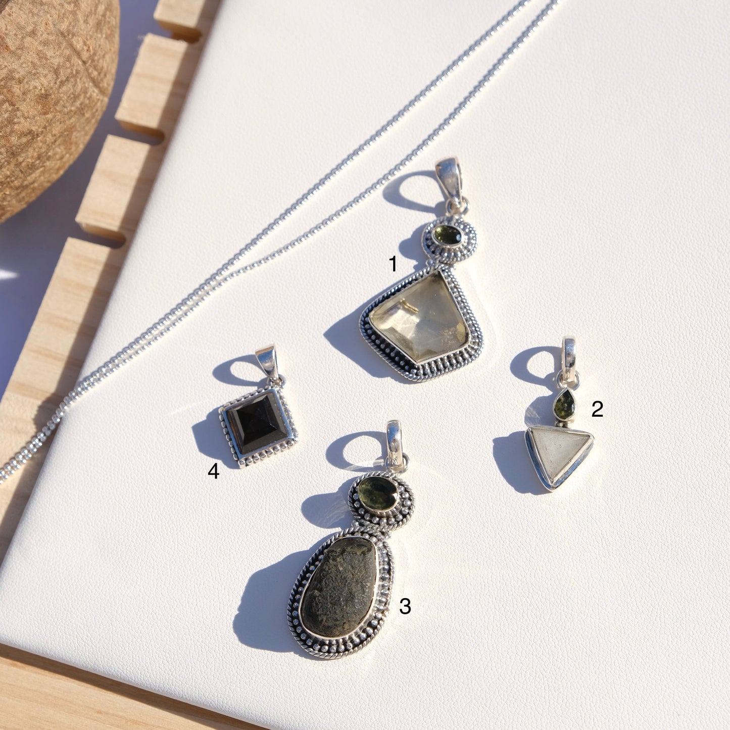 moldavite, cintamani, columbianite pendants