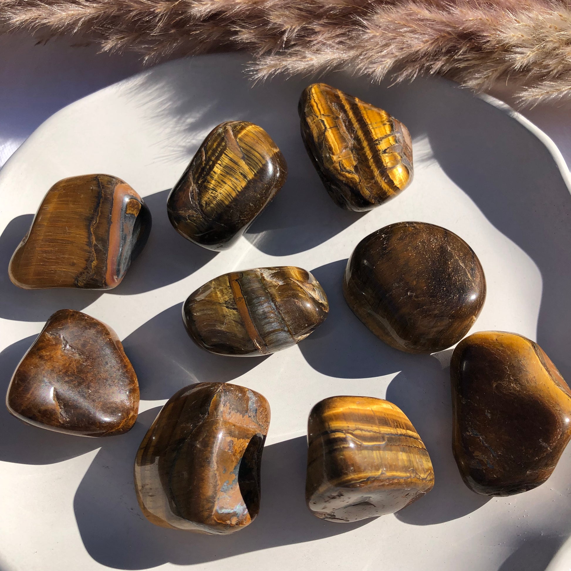 Large tigers eye tumbled stones 