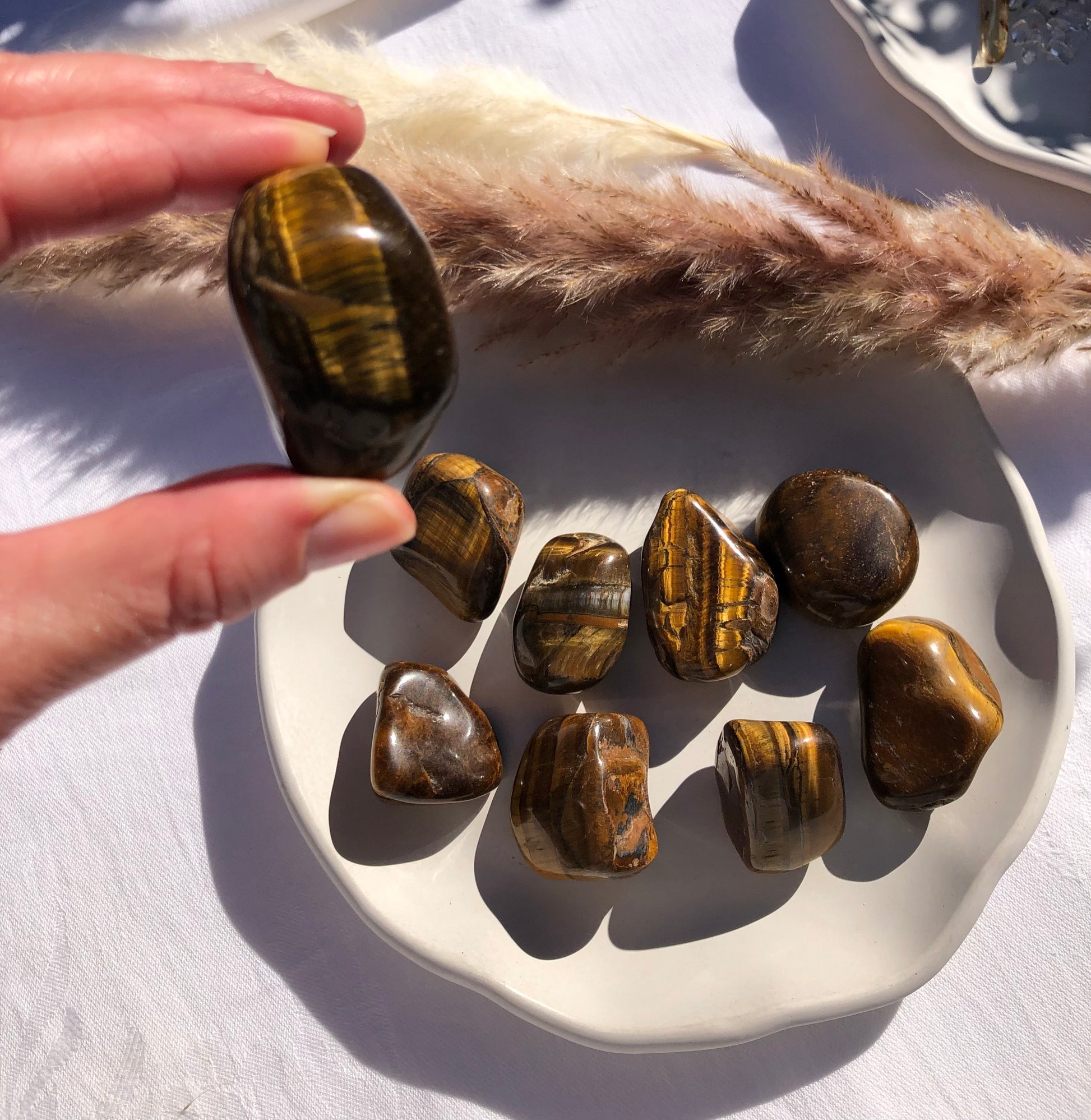 Large tigers eye tumbled stones