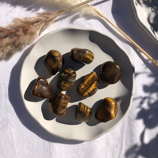 Large tigers eye tumbled stones